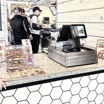 Slim Chickens - a man ordering food at a counter - Chicken Shop Near Me - Parker, Colorado