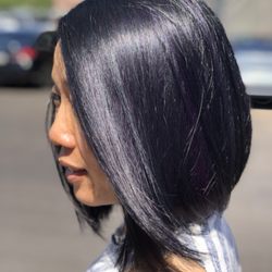 Memphis Manes - Textured bob haircut with black root touch up and purple peek a boos throughout whole head. This is a double process procedure