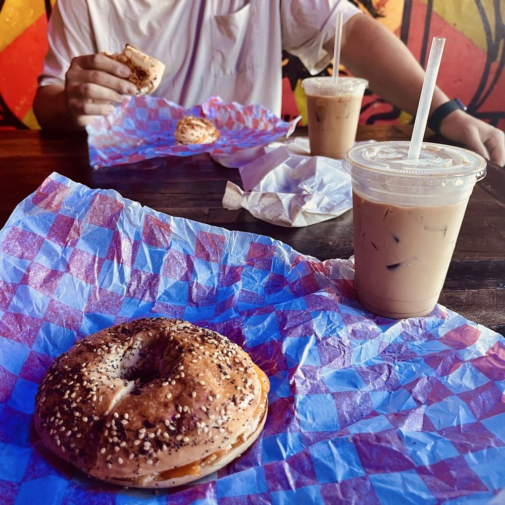 Iced caramel comet latte, white chocolate raspberry iced latte, and two sausage egg and cheese bagels