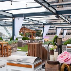 The Overlook - Wedding setup with white drapes on the rooftop terrace