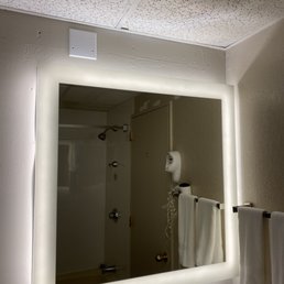 Room condition.  Stained acoustic ceiling tiles in the shower.