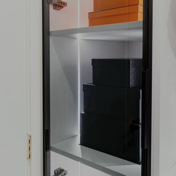 Perfect Precision Home Designs - CLOSET SHELVES WITH GLASS DOOR AND LIGHTING - Cabinetry Near Me Perfect Precision Home Designs - CLOSET SHELVES WITH GLASS DOOR AND LIGHTING - Cabinetry Near Me