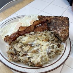 Andes Variety - Eggs over easy, bacon, wheat toast and shredded hash browns with cheese and mushrooms. Delicious!