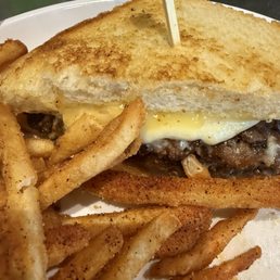 MIDWEST MELTDOWN Patty melt with two patties, Gouda, Monterey Jack, Cheddar, American, garlic aioli, and herbed onions on brioche bread. MIDWEST MELTDOWN Patty melt with two patties, Gouda, Monterey Jack, Cheddar, American, garlic aioli, and herbed onions on brioche bread.