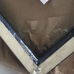 Michaels - Glue sloppily applied around back of frame.