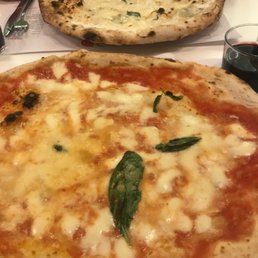 Margarita pizza and 4 cheeses in the back.
