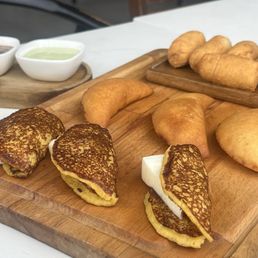 Shared platter with mini arepas, tequenos and mini cachapas