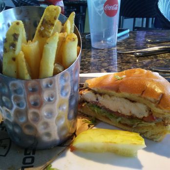 Topgolf - Grilled chicken sandwich, fries and a pickle - New American Near Me - Fort Worth, Texas Topgolf - Grilled chicken sandwich, fries and a pickle - New American Near Me - Fort Worth, Texas