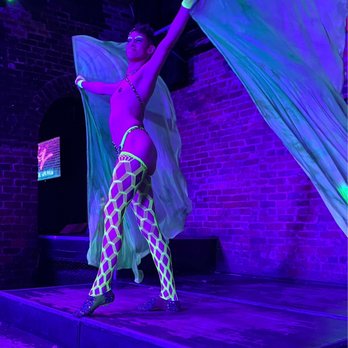 Oz New Orleans - a woman performing a belly dance - Gay Bars Near Me - New Orleans, Louisiana