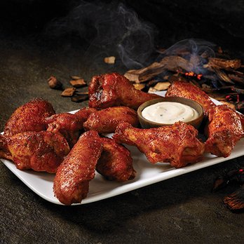 Hooters - a plate of chicken wings with dipping sauce - Sports Bars Near Me - Texarkana, Texas