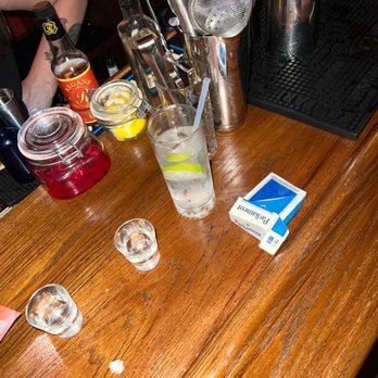 Little Beaver - a wooden bar with a few glasses of water - Dive Bars Near Me - New York, New York