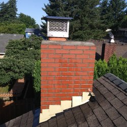 Chimcare Salem - After photo of a chimney repair job.  We tuck-pointed all of the joints above roofline and added a rooftop damper/ chimney cap.