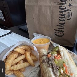 Chicagoland - A dipped Chicago Italian beef, fries and cheese sauce to dip the fries into.