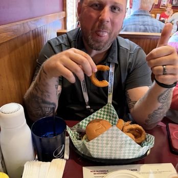 5-8 Club - Kenny enjoying the Roadhouse with onion rings. - Burgers Near Me - Minneapolis, Minnesota 5-8 Club - Kenny enjoying the Roadhouse with onion rings. - Burgers Near Me - Minneapolis, Minnesota