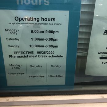 Walgreens - a pharmacy hours sign in a window - Drugstores Near Me - Gonzales, Louisiana