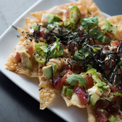 Photo of Yard House - Indianapolis, IN, US. Satisfy your tastebuds with 1/2 off select appetizers, like our Poke Nachos, and all pizzas during Happy Hour and Late Night Happy Hour.