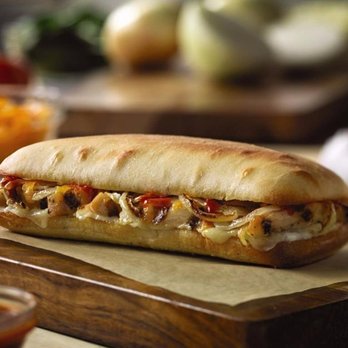 Domino's Pizza - a sub sandwich on a cutting board - Pizza Near Me - Ashland, Wisconsin Domino's Pizza - a sub sandwich on a cutting board - Pizza Near Me - Ashland, Wisconsin