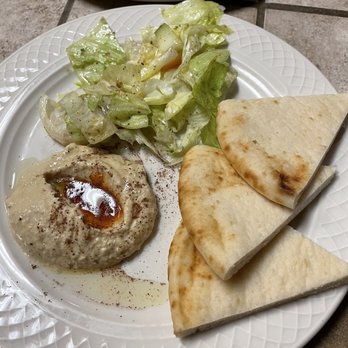 The Basha Cuisine - The side plate that comes with any dinner menu item. The hummus has hot sauce in the middle - so good. - Middle Eastern Near Me - Overland Park, Kansas The Basha Cuisine - The side plate that comes with any dinner menu item. The hummus has hot sauce in the middle - so good. - Middle Eastern Near Me - Overland Park, Kansas