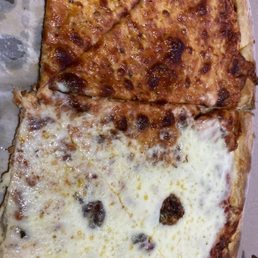 They put new cheese on a old pizza? I can visibly see the old cheese underneath? They put new cheese on a old pizza? I can visibly see the old cheese underneath?