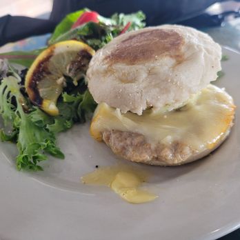 Oceana Coffee - BREKKY SANDWICH: "Brekky" is an Aussie term for breakfast. Consists of cheese, egg, and a sausage. Served with greens and vinegerette. - Coffee & Tea Near Me - Tequesta, Florida