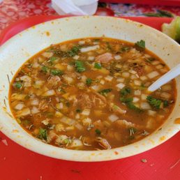Menudo filled with so much meat and delicious broth, mixed with their salsa roja. Menudo filled with so much meat and delicious broth, mixed with their salsa roja.