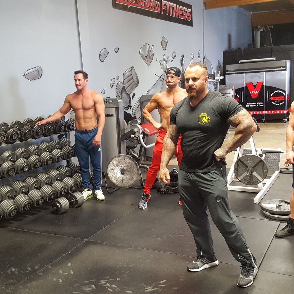 Coach working one on one with his clients post routine.. Coach working one on one with his clients post routine..