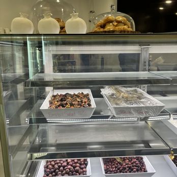 Cafe POM - a display case with a variety of desserts - Cafes Near Me - Paoli, Pennsylvania