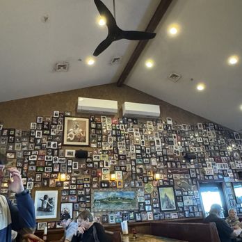 Dead Dog Saloon - Indoor picture wall of dogs who have crossed the rainbow bridge - Seafood Near Me - Murrells Inlet, South Carolina