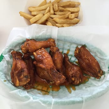 Mighty Wings - Extra crispy wings and fries in medium sauce... $7.75. SO GOOD!!!! - Chicken Wings Near Me - Kissimmee, Florida Mighty Wings - Extra crispy wings and fries in medium sauce... $7.75. SO GOOD!!!! - Chicken Wings Near Me - Kissimmee, Florida