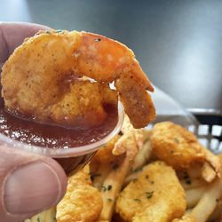 Who Dat Seafood Restaurant & Sports Bar - Shrimp so big it barely fits in the cocktail sauce!