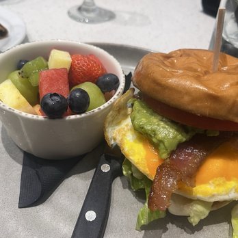 The Twisted Apron - breakfast sandwich with side of fruit - Comfort Food Near Me - Windsor, Ontario The Twisted Apron - breakfast sandwich with side of fruit - Comfort Food Near Me - Windsor, Ontario