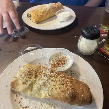 Johnny's New York Style Pizza - Syracuse Stromboli half of one Syracuse Stromboli - Italian Near Me - Hickory Flat, Georgia Johnny's New York Style Pizza - Syracuse Stromboli half of one Syracuse Stromboli - Italian Near Me - Hickory Flat, Georgia