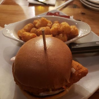 Eli Fish Brewing Company - Chicken sandwich with coleslaw and honey mustard on top - Breweries Near Me - Batavia, New York Eli Fish Brewing Company - Chicken sandwich with coleslaw and honey mustard on top - Breweries Near Me - Batavia, New York
