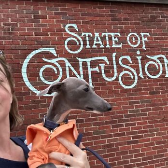 State of Confusion - Dogba in front of their sign - Peruvian Near Me - Chattanooga, Tennessee State of Confusion - Dogba in front of their sign - Peruvian Near Me - Chattanooga, Tennessee