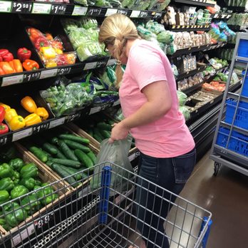 Walmart - a woman shopping in a grocery store - Department Stores Near Me - Forney, Texas