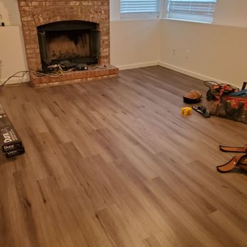 Valley Hardwood Floors - a fireplace in a living room - Flooring Near Me - Denver, Colorado