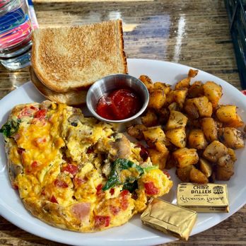 Relish Burger Bistro - Omelette with side of potatoes and toast - New American Near Me - Seattle, Washington Relish Burger Bistro - Omelette with side of potatoes and toast - New American Near Me - Seattle, Washington