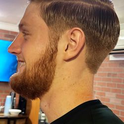 Steven's Barber Shop - Business man's cut created with a relaxing full service beard spa.
