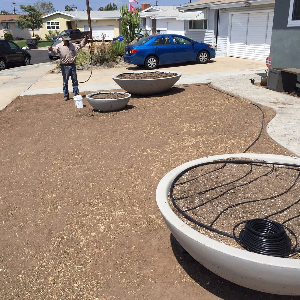 Ricardo's Landscaping - a man watering a garden - Landscaping Near Me - San Diego, California Ricardo's Landscaping - a man watering a garden - Landscaping Near Me - San Diego, California