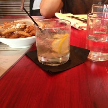 Salty Sow - Zen Jen drink and truffle fries in the back ground - American Near Me - Austin, Texas Salty Sow - Zen Jen drink and truffle fries in the back ground - American Near Me - Austin, Texas