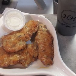 The Holiday House Restaurant - Boneless chicken tenders tossed in garlic parmesan