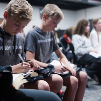 Antioch - Students taking notes as Student Lead preaches at ASM Midweek. - Churches Near Me - Georgetown, Texas Antioch - Students taking notes as Student Lead preaches at ASM Midweek. - Churches Near Me - Georgetown, Texas