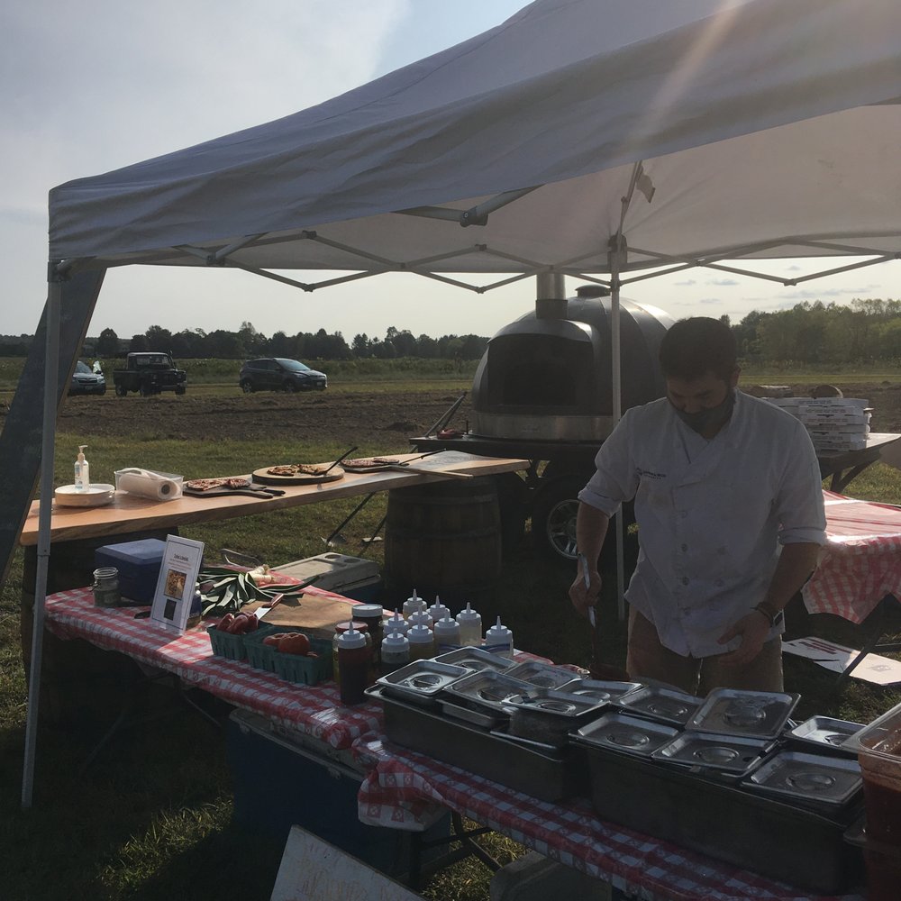 W's Wood Fired Pizza - Prepping your pie for baking - Pizza Near Me - Cranston, Rhode Island W's Wood Fired Pizza - Prepping your pie for baking - Pizza Near Me - Cranston, Rhode Island