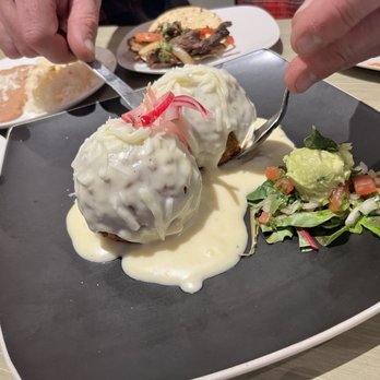 Queens Bar & Grill - Stuffed Avocados with a fabulous cheese sauce! - Mexican Near Me - Fayetteville, Arkansas Queens Bar & Grill - Stuffed Avocados with a fabulous cheese sauce! - Mexican Near Me - Fayetteville, Arkansas
