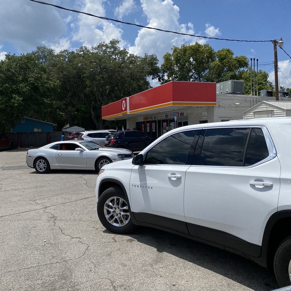 Circle K - a white suv parked in a parking lot - Convenience Stores Near Me - Lakeland, Florida