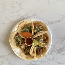 $1 taco Tuesday! 2 chicken tacos, 2 spicy marinated pork tacos, 2 fried pork tacos + hot salsa ($0.25)!