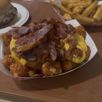 Skan-Ellus Drive In - Loaded tater tots, fries, and double cheeseburger - Ice Cream & Frozen Yogurt Near Me - Skaneateles, New York Skan-Ellus Drive In - Loaded tater tots, fries, and double cheeseburger - Ice Cream & Frozen Yogurt Near Me - Skaneateles, New York