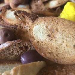 Black Pony - Flavorful toasts and olives and pickled cauliflower of the charcuterie board