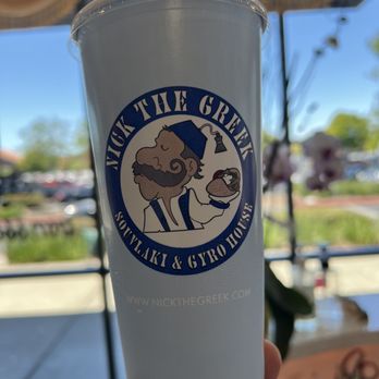 Nick the Greek - a cup with a straw in it - Greek Near Me - Napa, California Nick the Greek - a cup with a straw in it - Greek Near Me - Napa, California