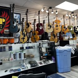 Moe's Music - Large selection of guitars.